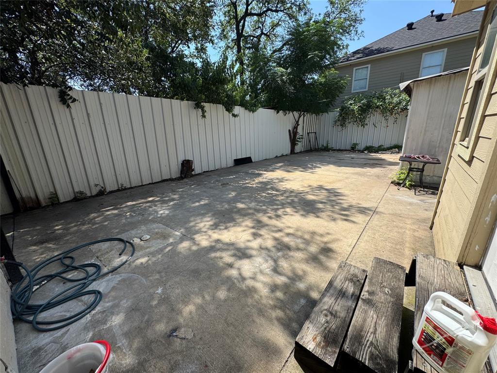 Fenced backyard featuring a patio