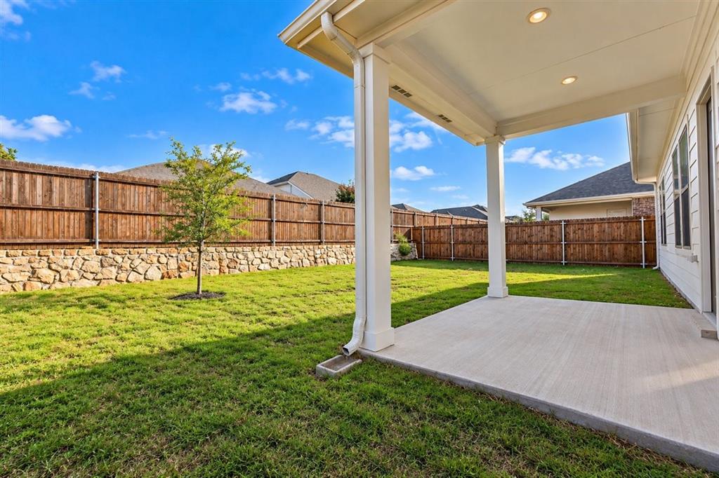 Covered patio with recessed lighting, concrete flooring, and support columns