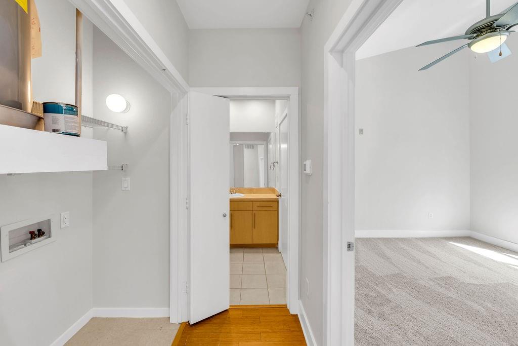 Dedicated laundry area with wall-mounted lighting
