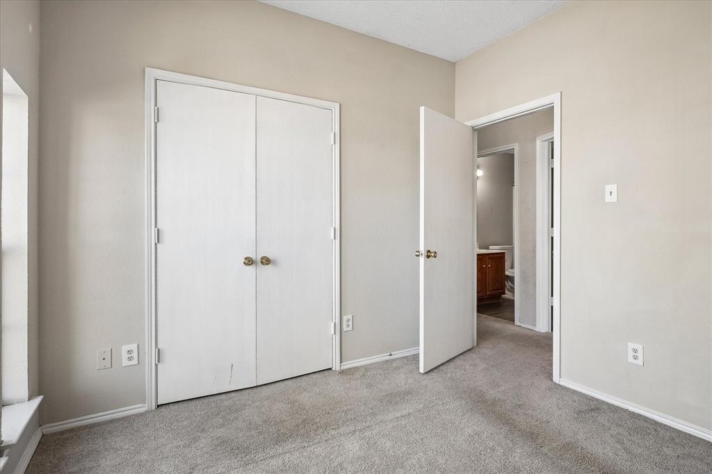 Neutral wall color, light gray carpeting, and white trim throughout