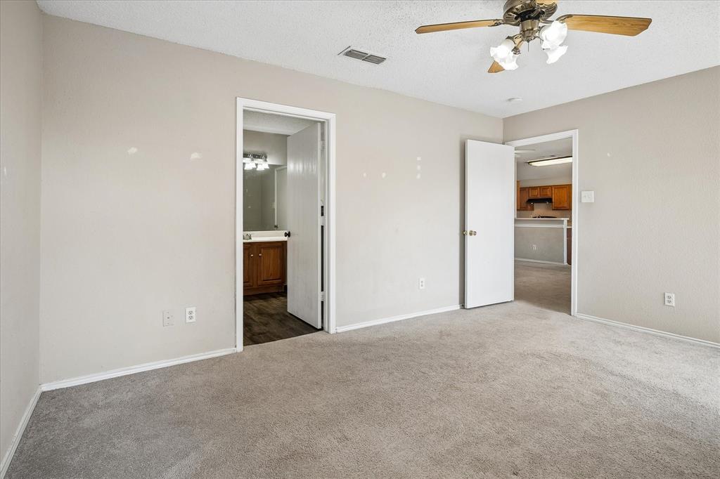 Neutral-toned walls and carpeting