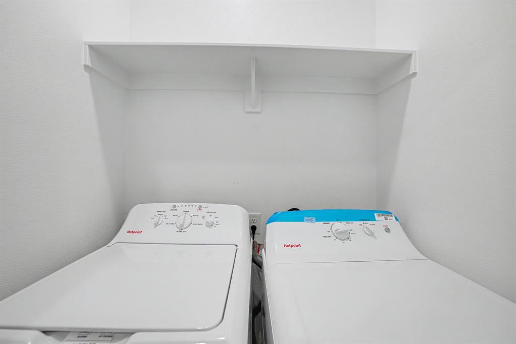 Built-in overhead shelving with a white finish