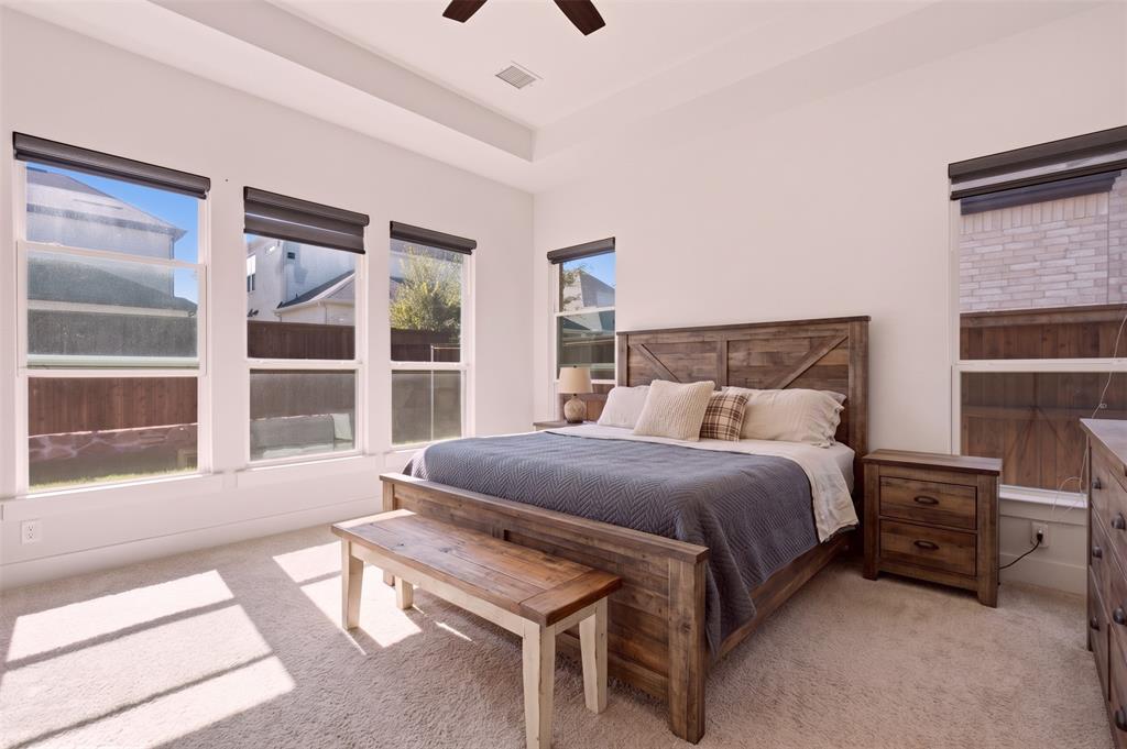 Sun-filled primary bedroom - virtually staged