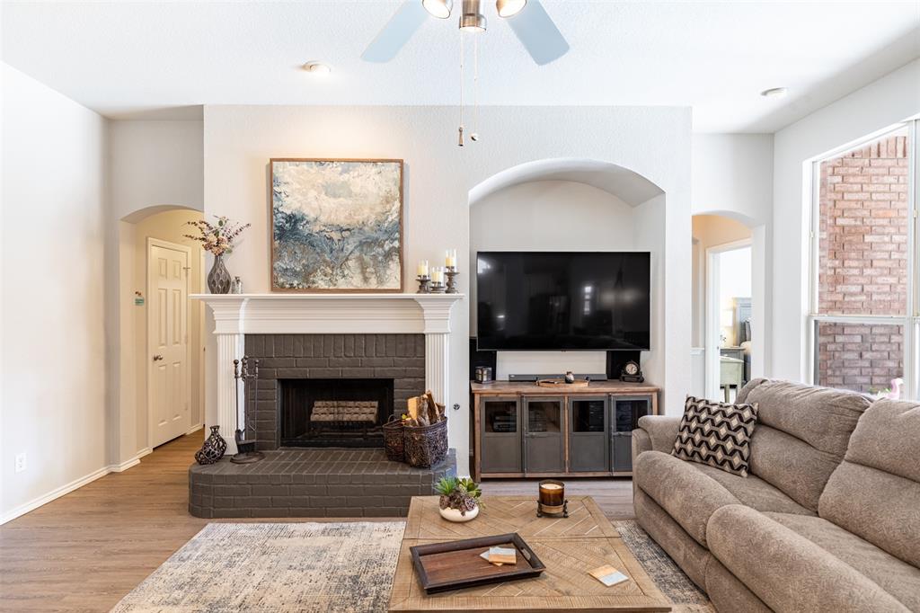 Living room anchored by a cozy fireplace.