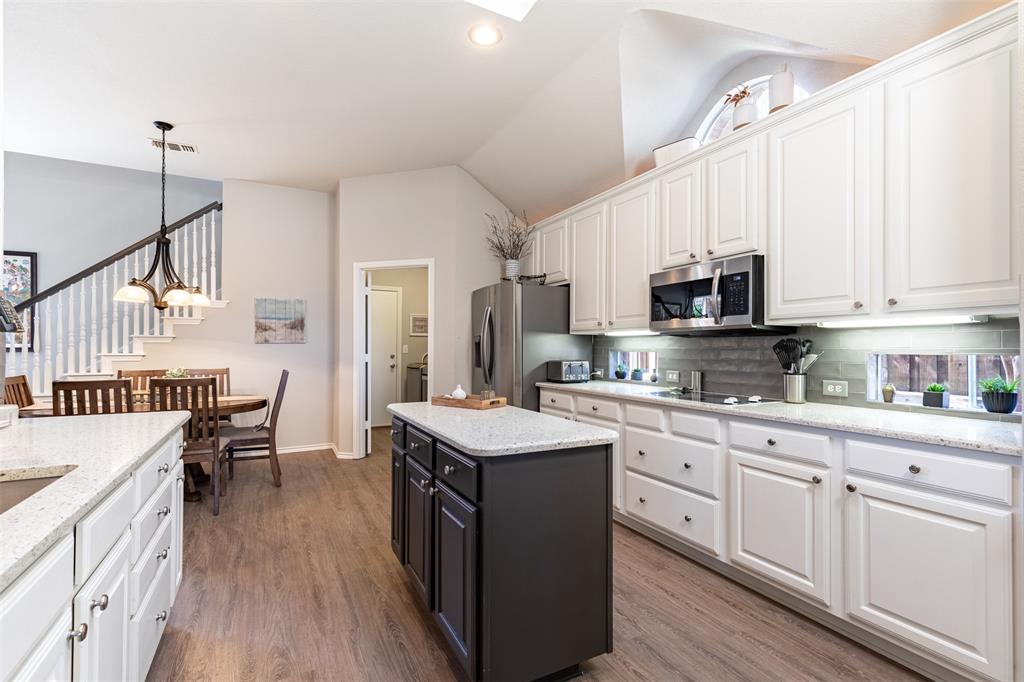 Open-concept kitchen to breakfast room. Open-concept kitchen to breakfast room.