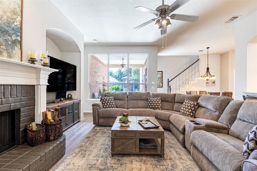 Living room with wall of windows overlooking the outdoor patio.