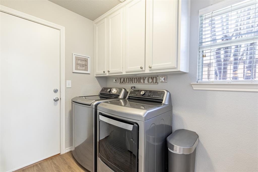 Laundry room with built-ins & a walk-in storage closet.