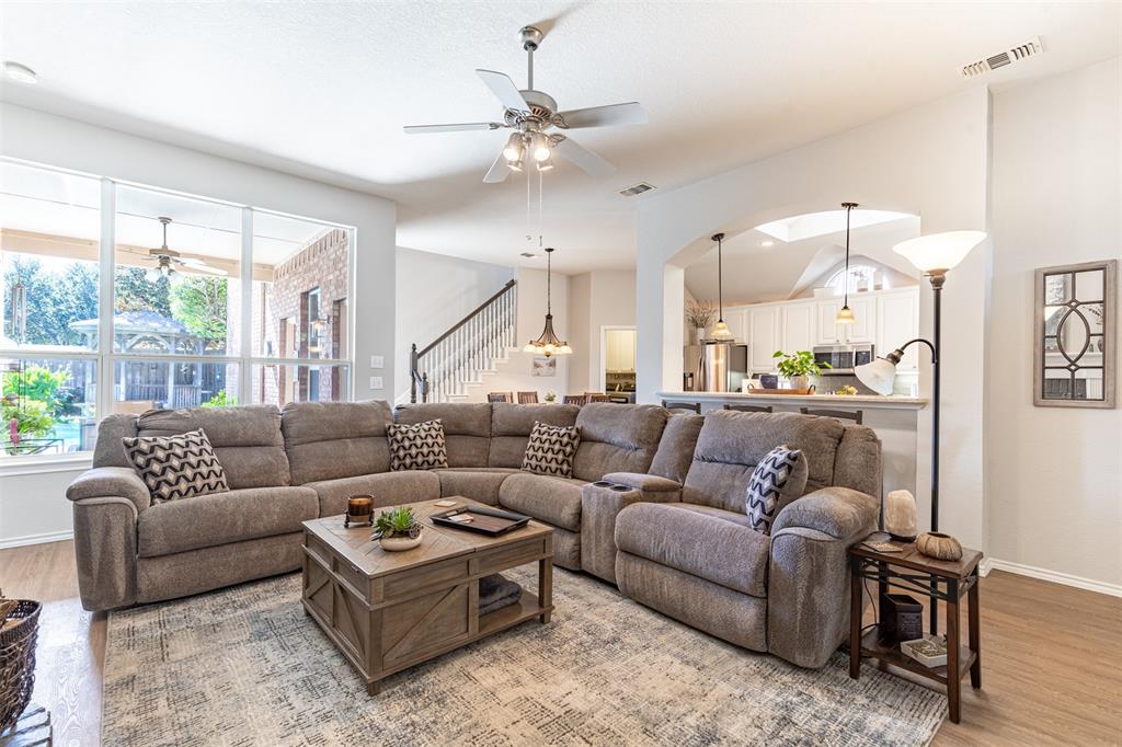 Living room flows seamlessly to kitchen and breakfast room.