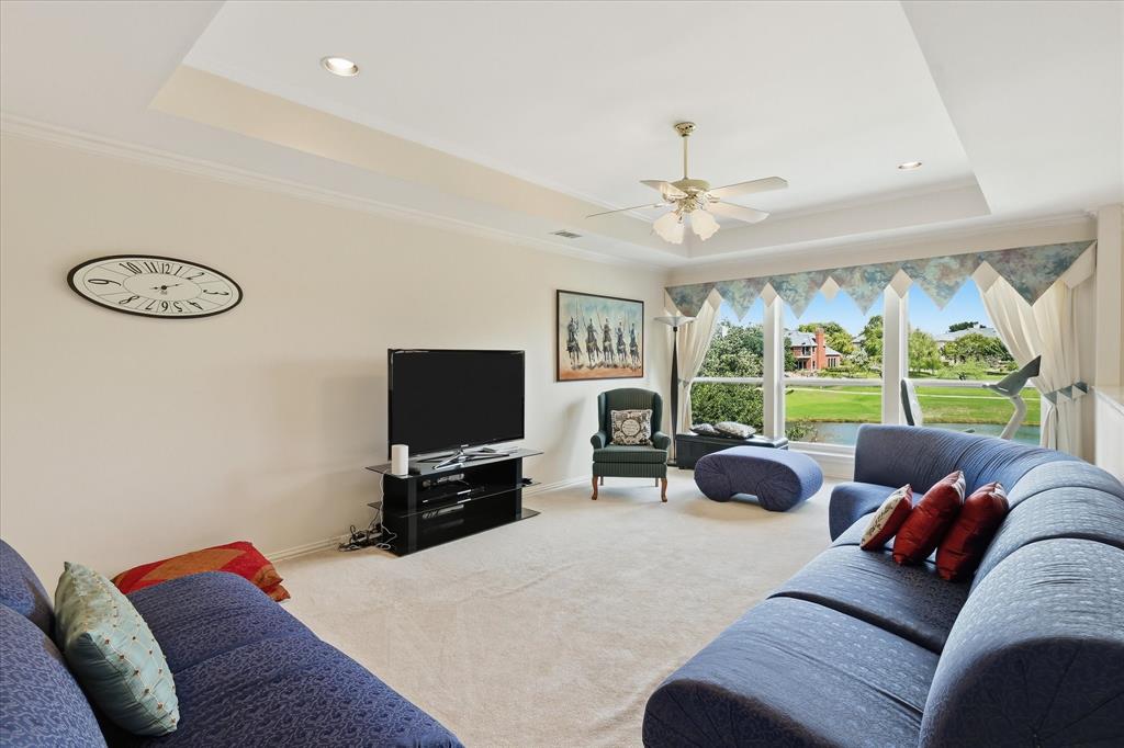 Spacious upstairs game room with picturesque views of the golf course & water