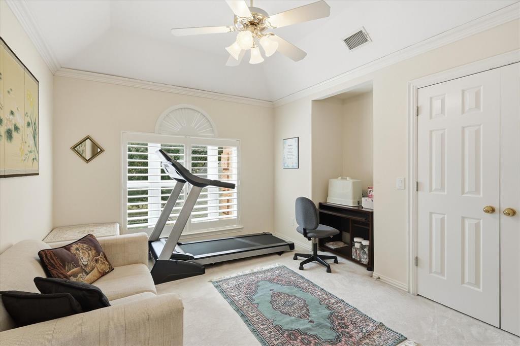 1 of 4 upstairs bedrooms makes a great home office, den, or workout space