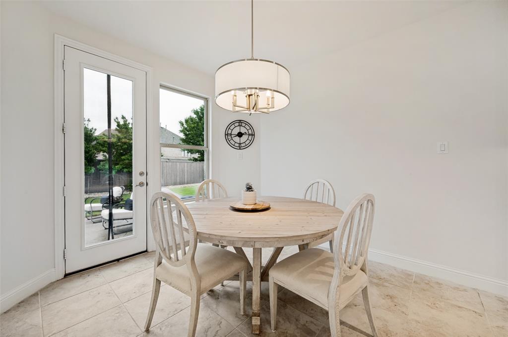 Tile flooring, a full-lite exterior door, and a built-in light fixture