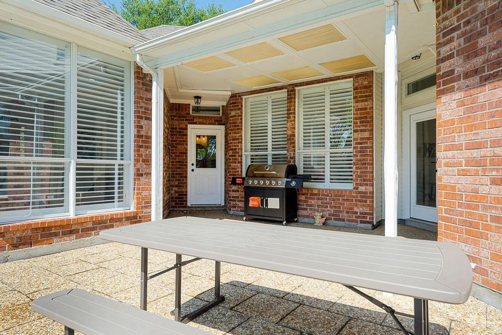 Covered patio featuring a coffered ceiling