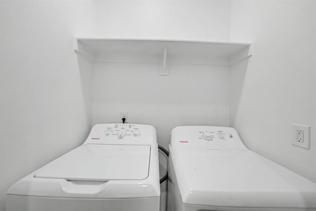 Laundry area with a built-in white shelf