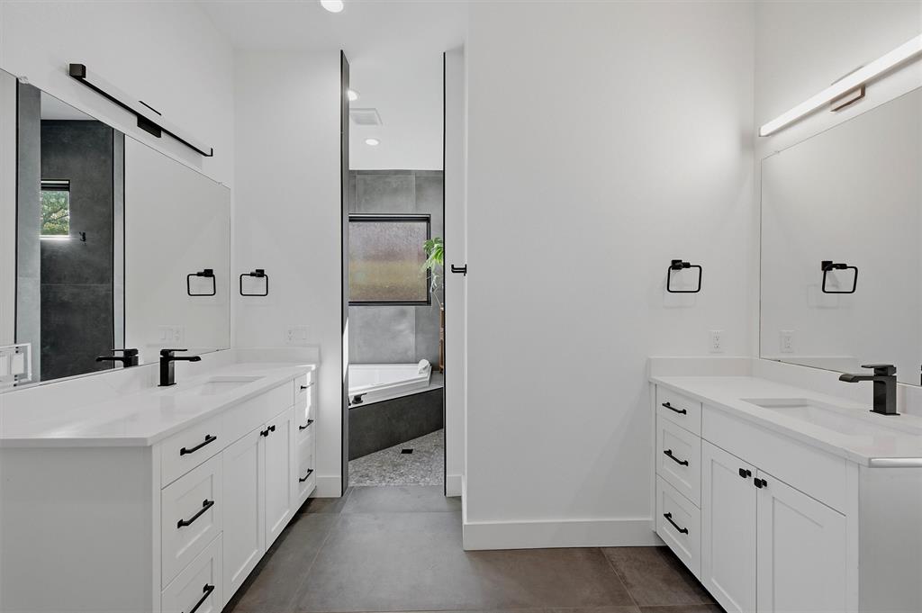 Primary bathroom - dual vanities, jetted soaking tub, stand-alone shower