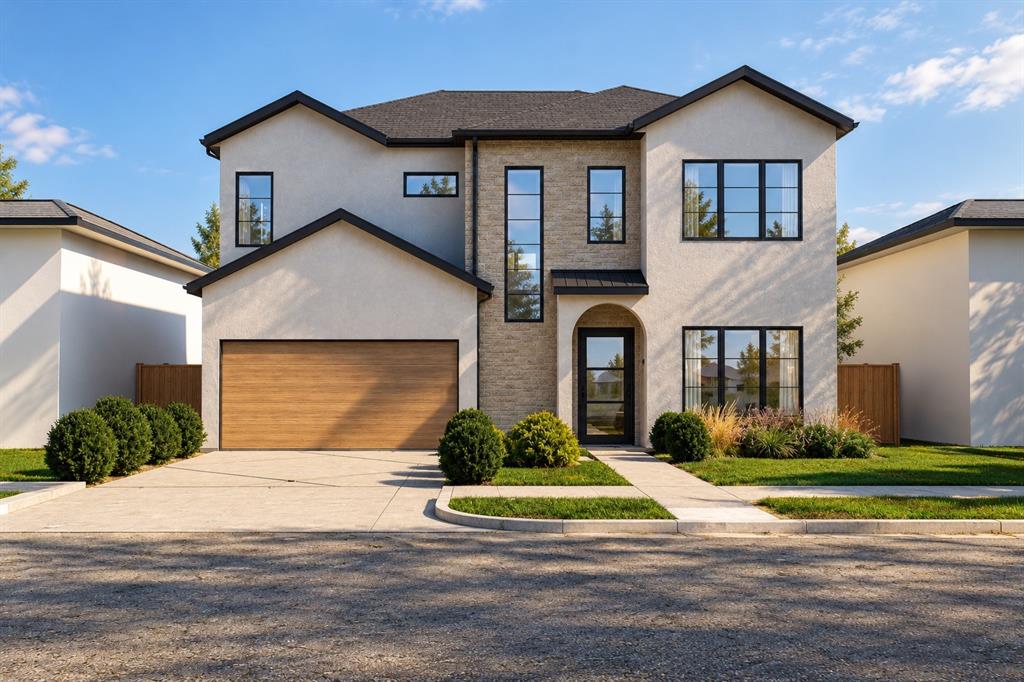Two-story exterior featuring a light-toned stucco facade, masonry stone veneer accents, multi-pane windows with black trim, a wood-finish garage door, and an arched entryway