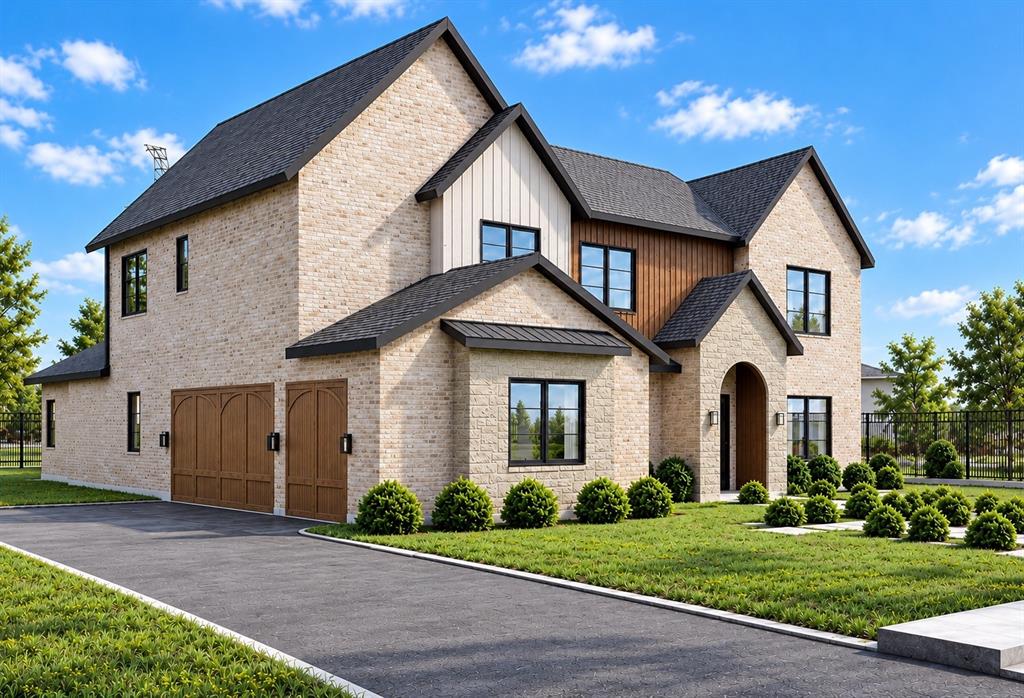 Two-story brick exterior featuring vertical board-and-batten siding accents, dark-framed windows, an arched entryway, and an attached multi-car garage