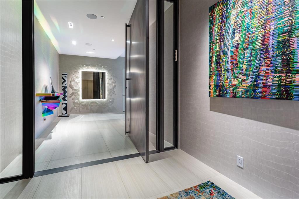 Private Elevator Entry opens to a gracious Foyer.