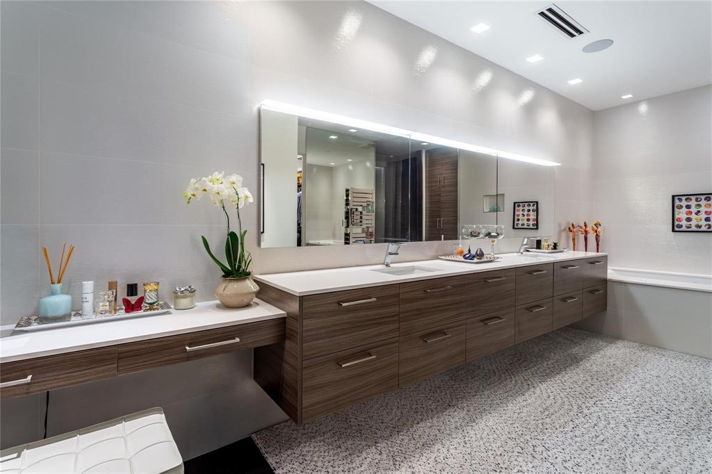 Porcelanosa Primary Bath with makeup table.