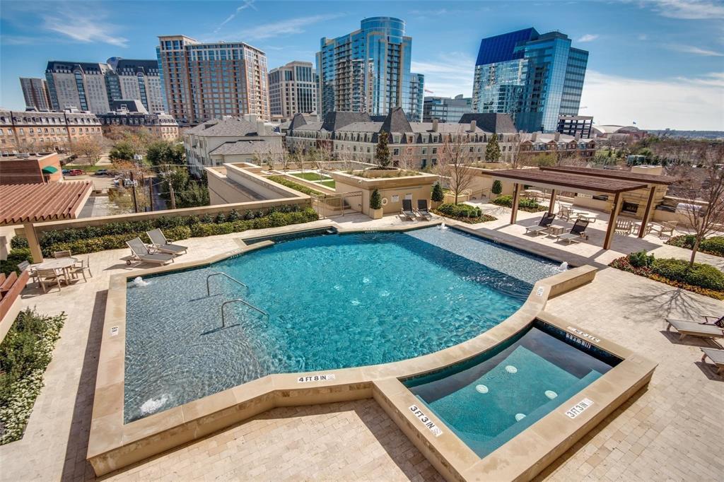 Evening skyline views are stunning past the pool and spa.