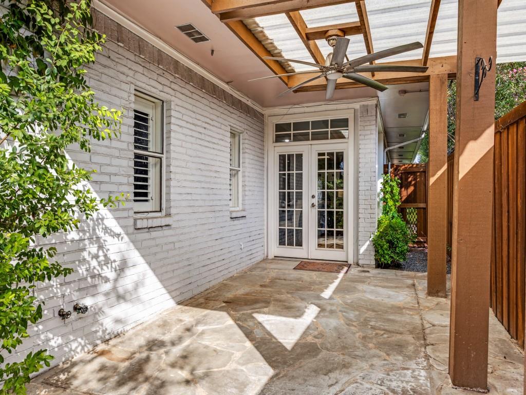 Private courtyard garden with covered patio and pergola