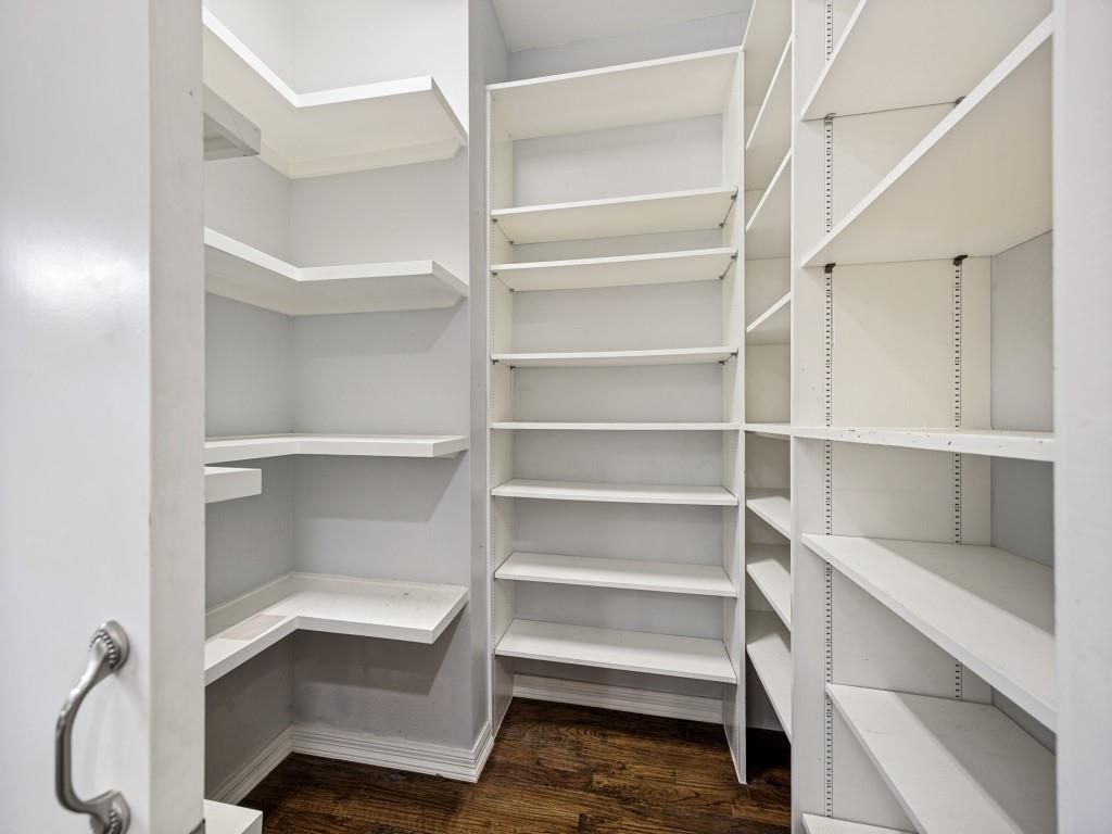 Walk-in pantry with floor-to-ceiling shelving