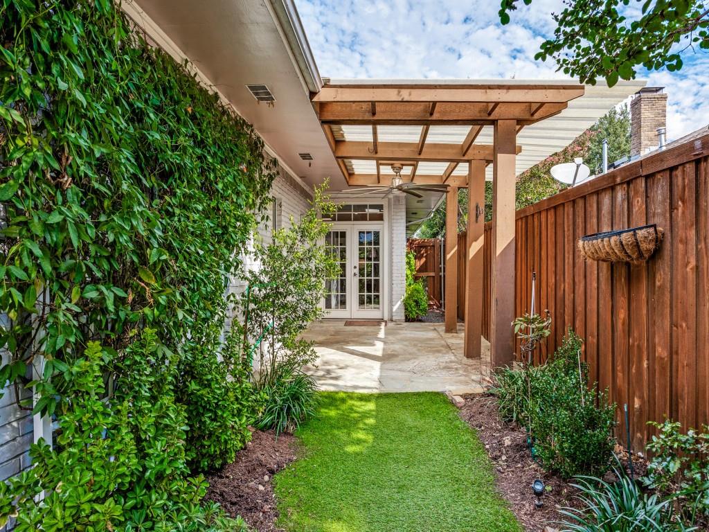 Landscaped backyard with turf and garden beds