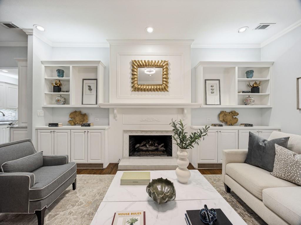 Fireplace with detailed mantel and built-in shelving
