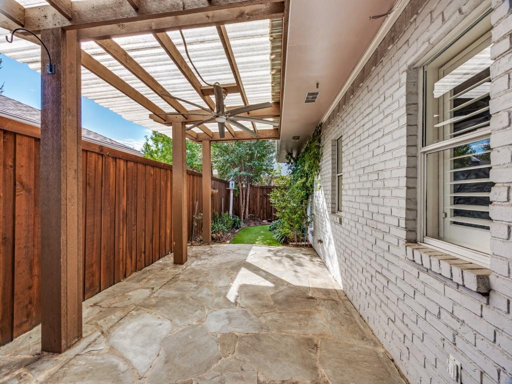Shaded flagstone patio under the pergola