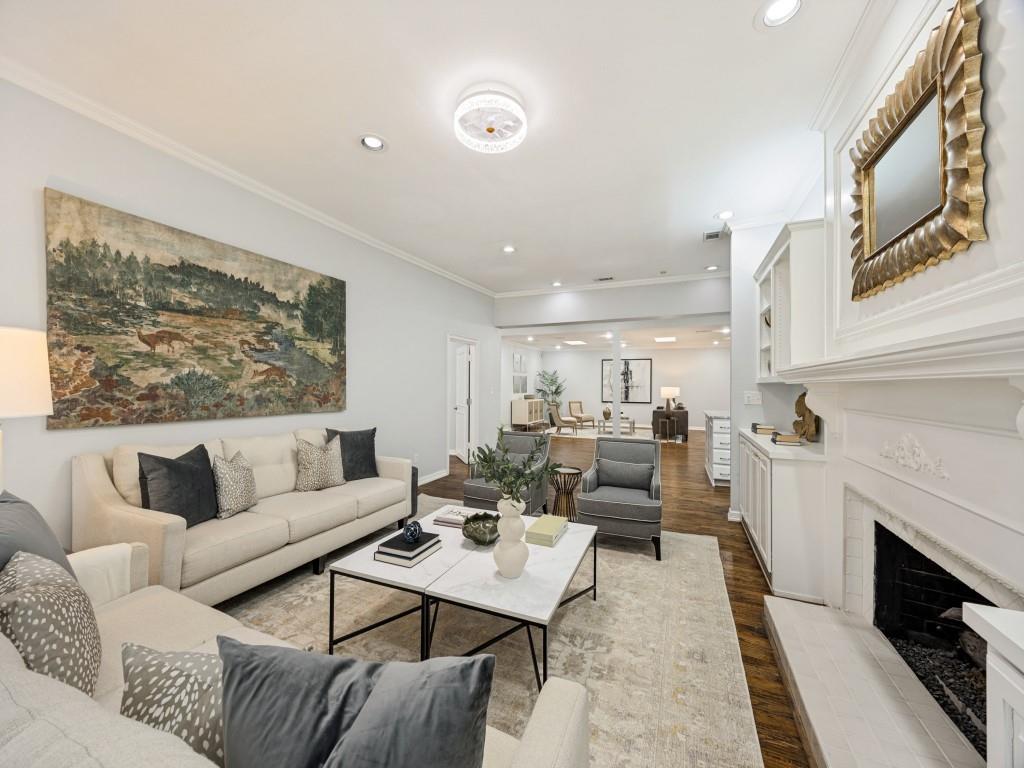 Den opens to the kitchen and main living areas