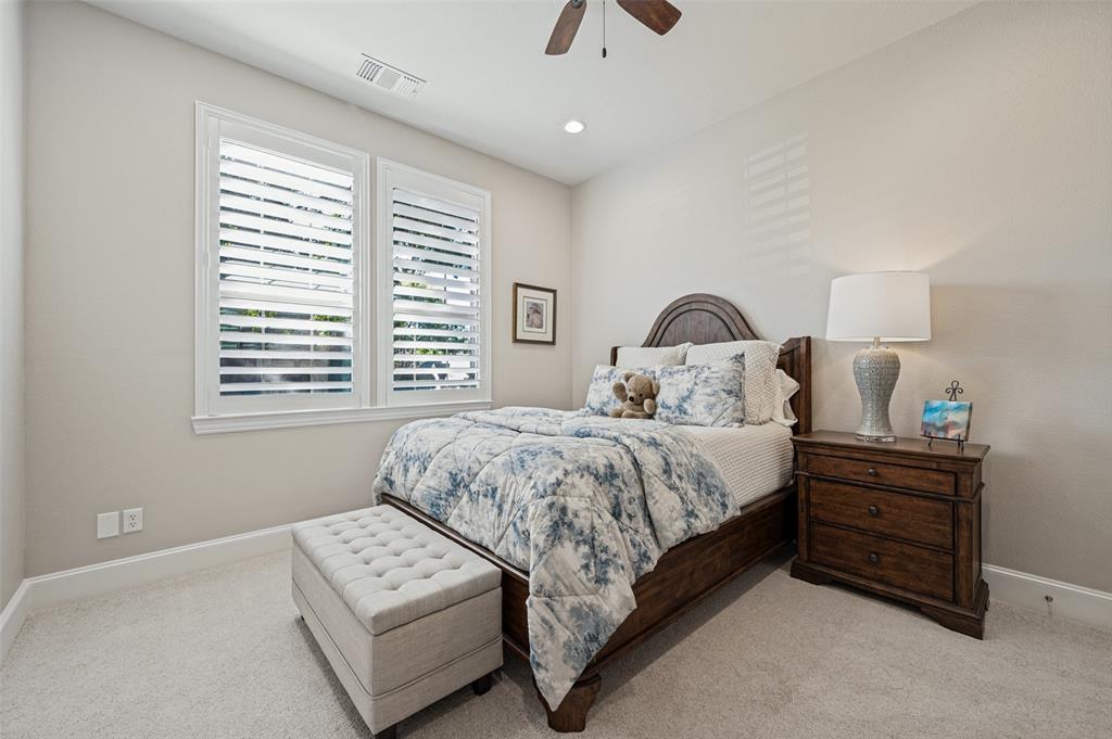 White plantation shutters, recessed ceiling lighting, a ceiling fan, and carpeted flooring