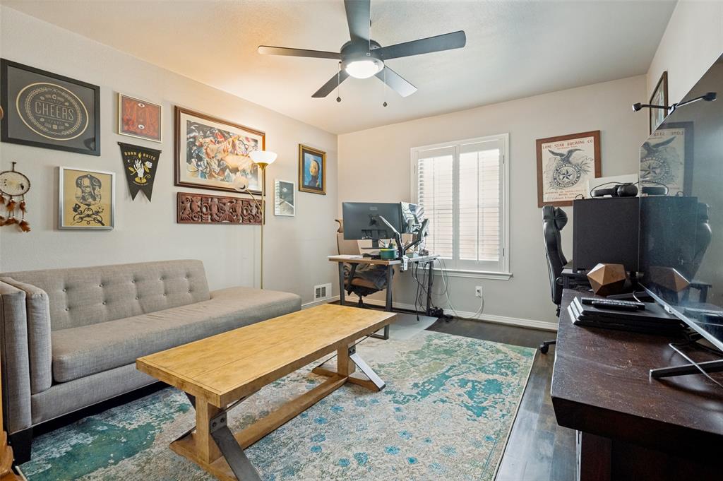 Interior room featuring wood-finish flooring and light gray wall paint