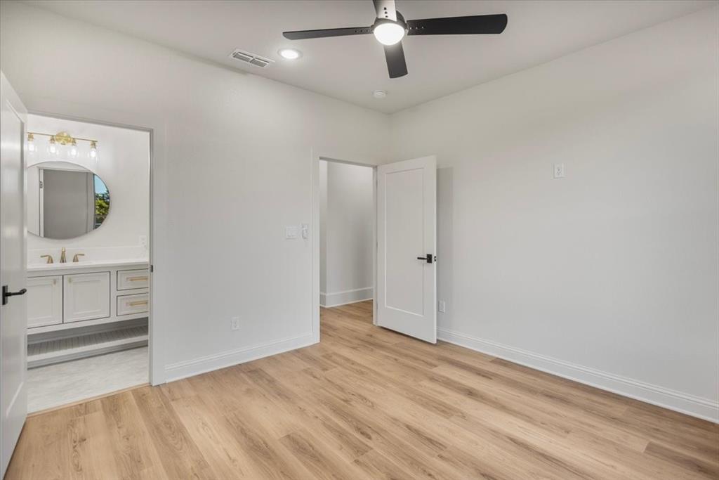 Wood-finish flooring, recessed lighting, and a ceiling fan