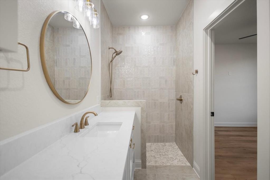 Quartz countertop with integrated sink and brass-finish faucet