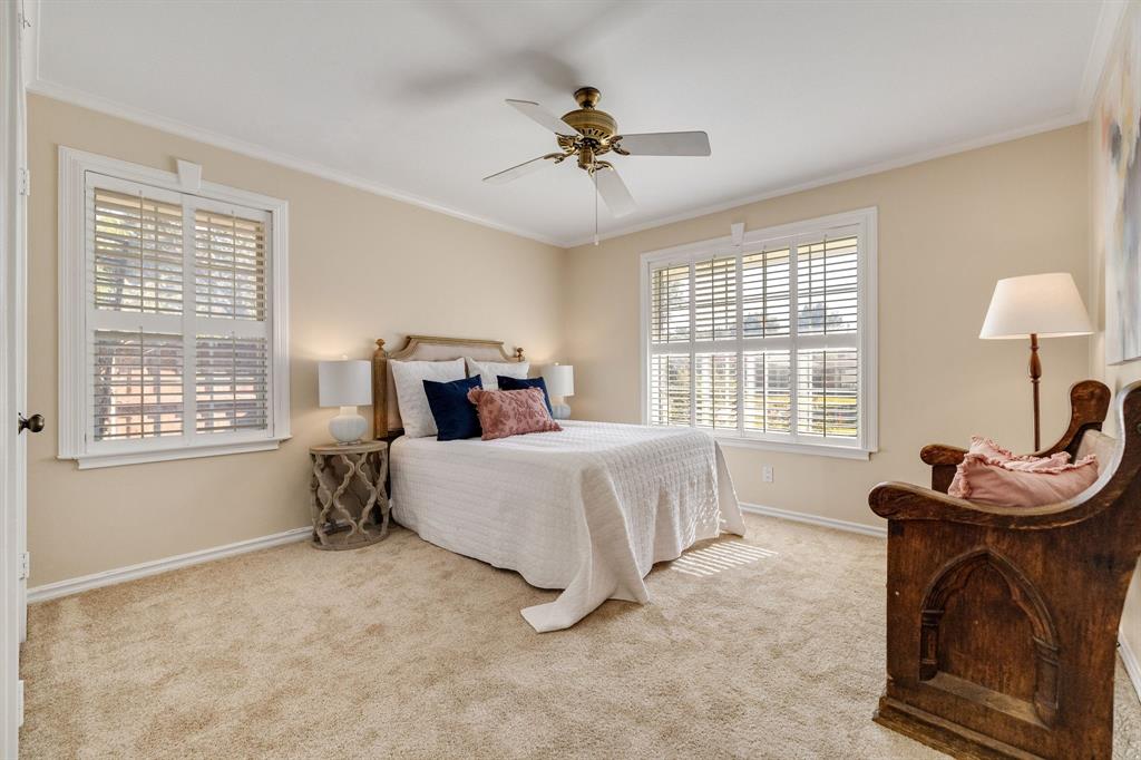 This is one of two secondary bedrooms.  This one is quite spacious with a long closet and large windows with trim and plantation shutters.  The walls are freshly painted and the carpet is brand new.  The seller also mentioned that there are wood floors underneath the carpet as well.