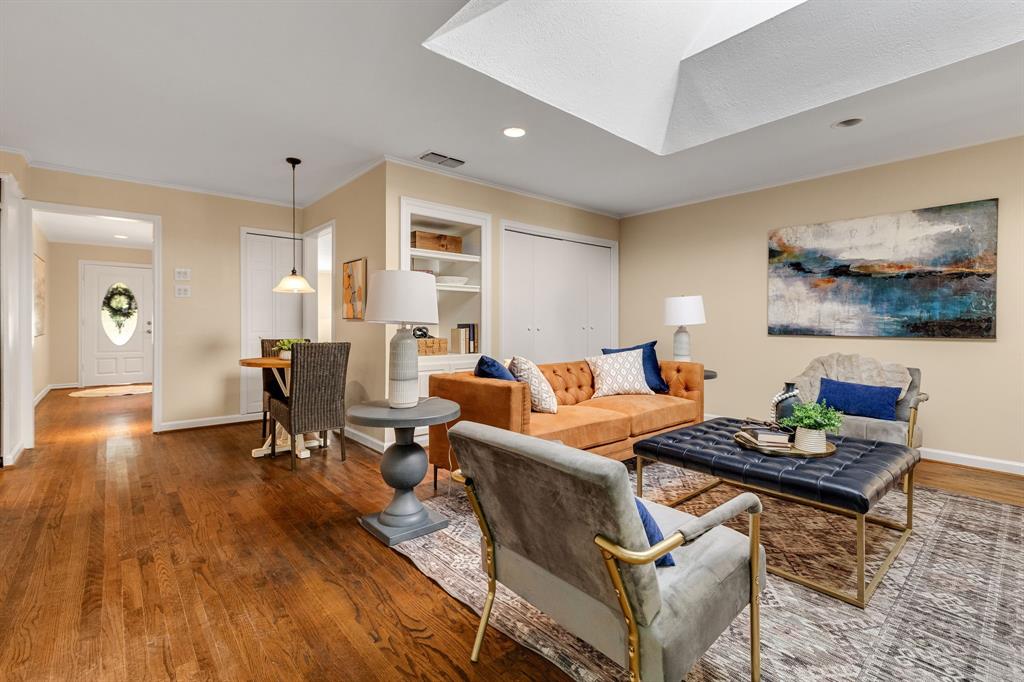 Beautiful! This view is from the corner of the family room looking towards the front of the house with a peek of the entry way and front door.