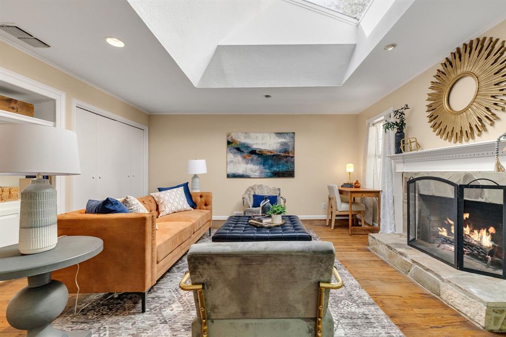 This is a generously sized room with plenty of room for lots of furniture and even a small desk area.