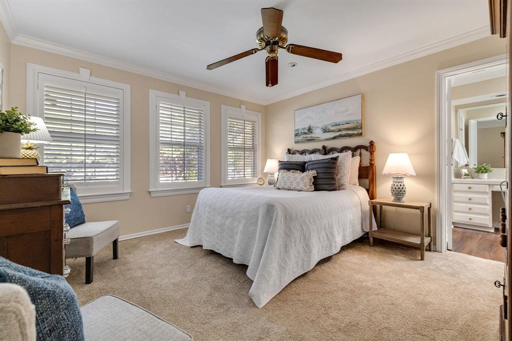 What a beautiful and relaxing primary suite with fresh paint, brand new carpet and custom plantation shutters.  The seller also mentioned that there are wood floors underneath the carpet as well.