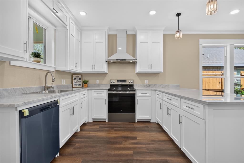 Kitchen featuring white shaker cabinetry, granite patterned countertops, stainless steel appliances, a stainless steel range hood, and wood-finish flooring