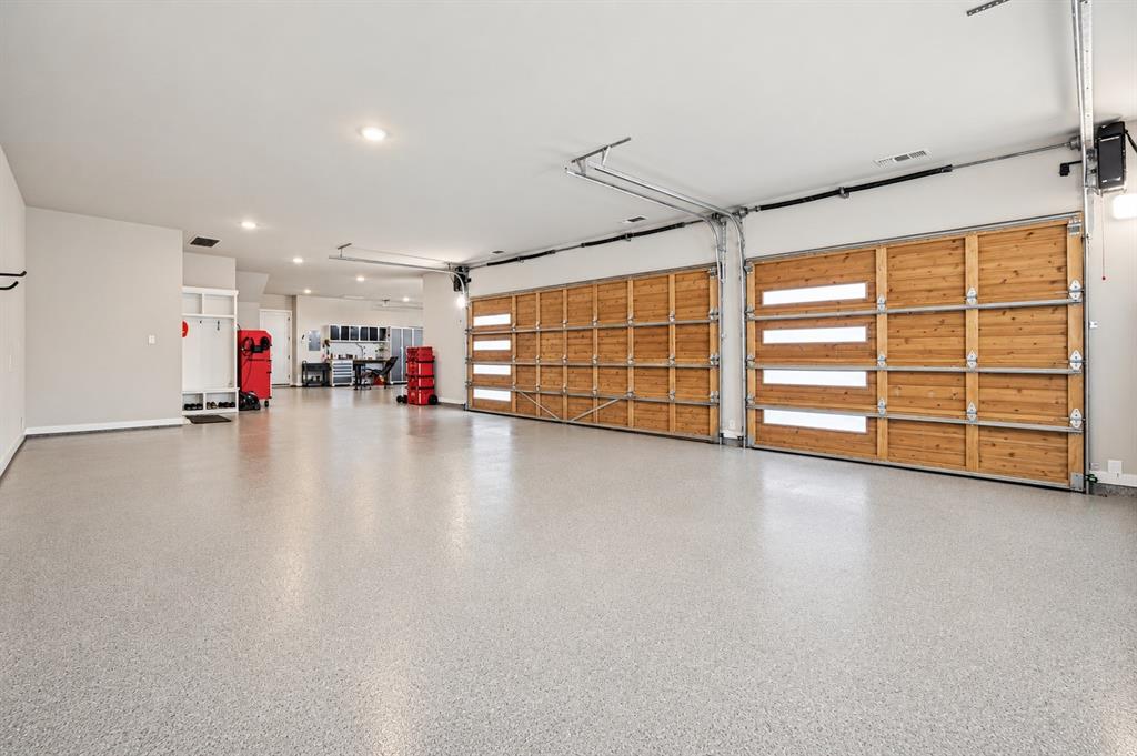 Oversied and temperature controlled, epoxy flooring & attic lift to take all your items to the Texas basement storage area.