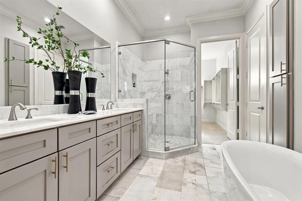 Primary bath, dual sinks, slipper tub and stand alone shower on third level