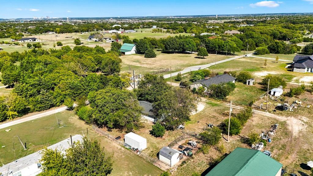 Expansive acreage featuring mature trees, diverse vegetation, open grassy areas