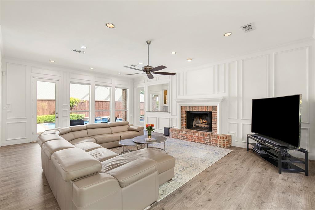 Soaring windows draw your eyes out toward the private backyard oasis and pool, flooding the main living area with beautiful natural light.