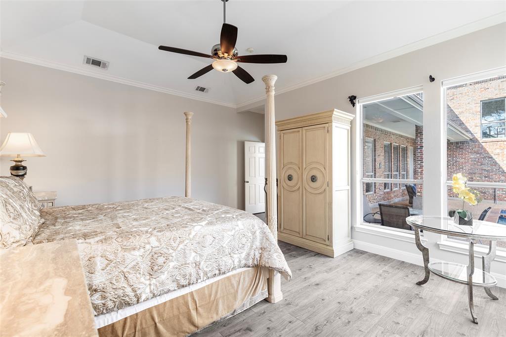 Generously sized and completely private, this master retreat offers a relaxing getaway with plenty of space for large furniture and scenic views of the covered patio.
