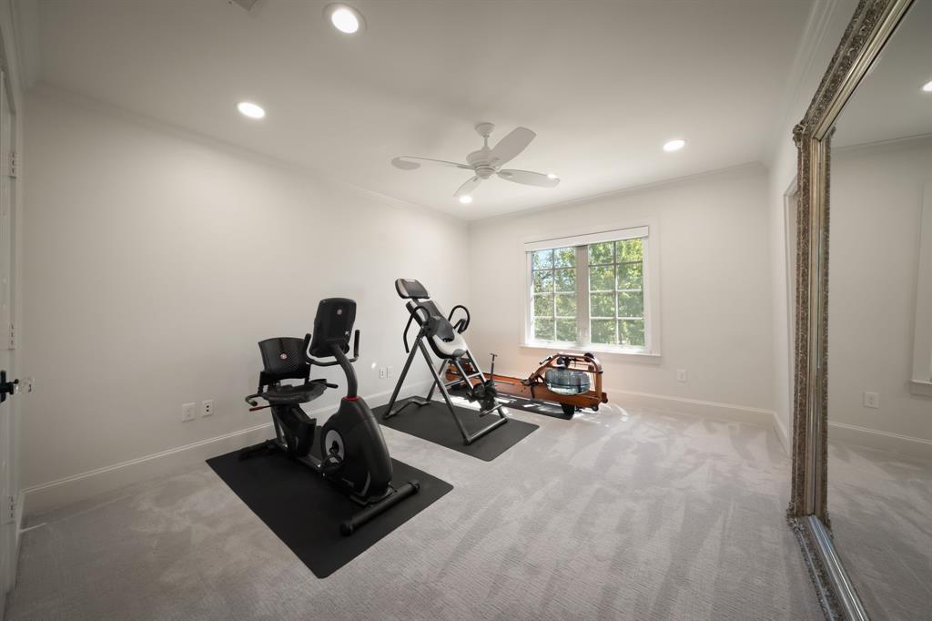 bedroom #2 of 4 upstairs staged as workout room