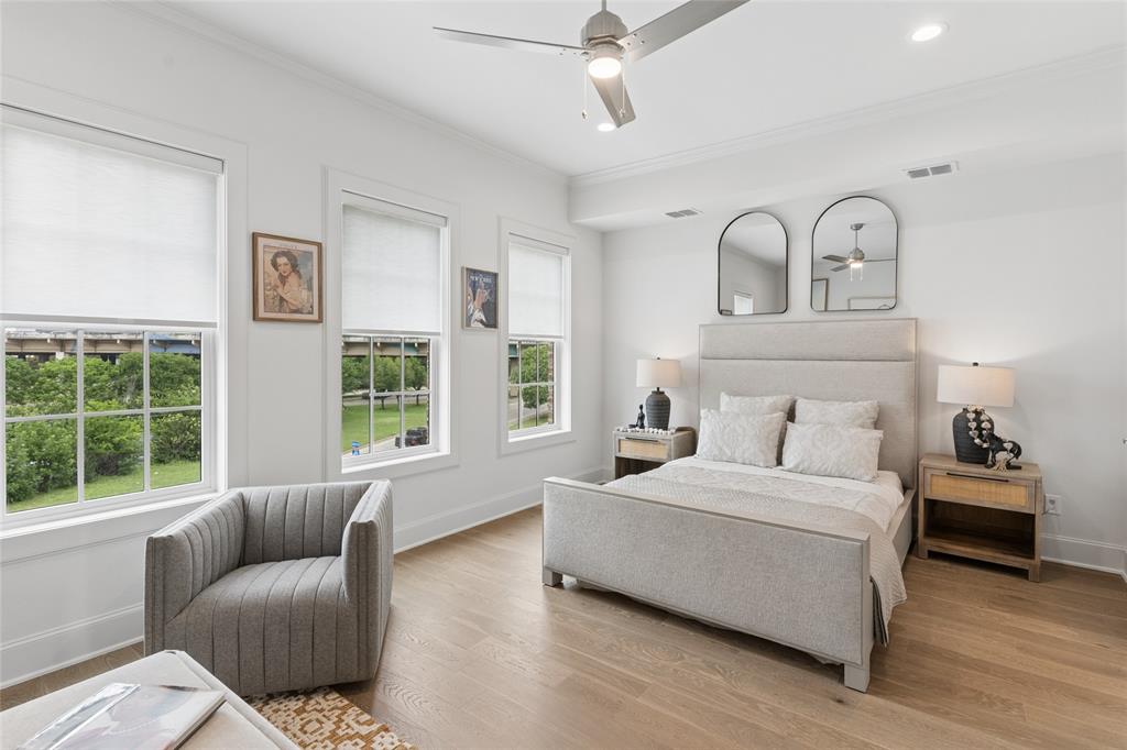 The spacious primary suite offers a private retreat, complete with a spa-inspired en suite bathroom and an expansive walk-in closet. Image of model home with similar layout.