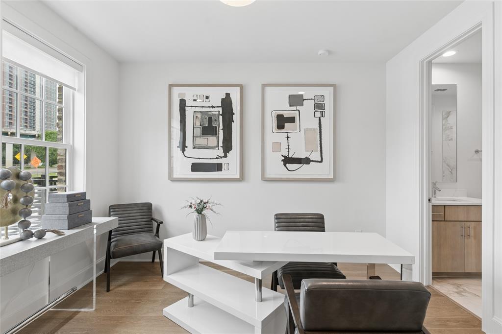 The spacious first-floor bedroom offers privacy and flexibility, ideal for guests or a home office. Image of model home with similar layout.