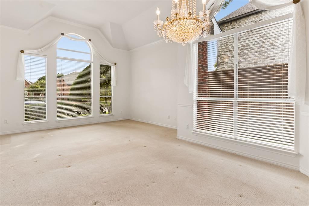 High ceilings in living room with lots of natural light.