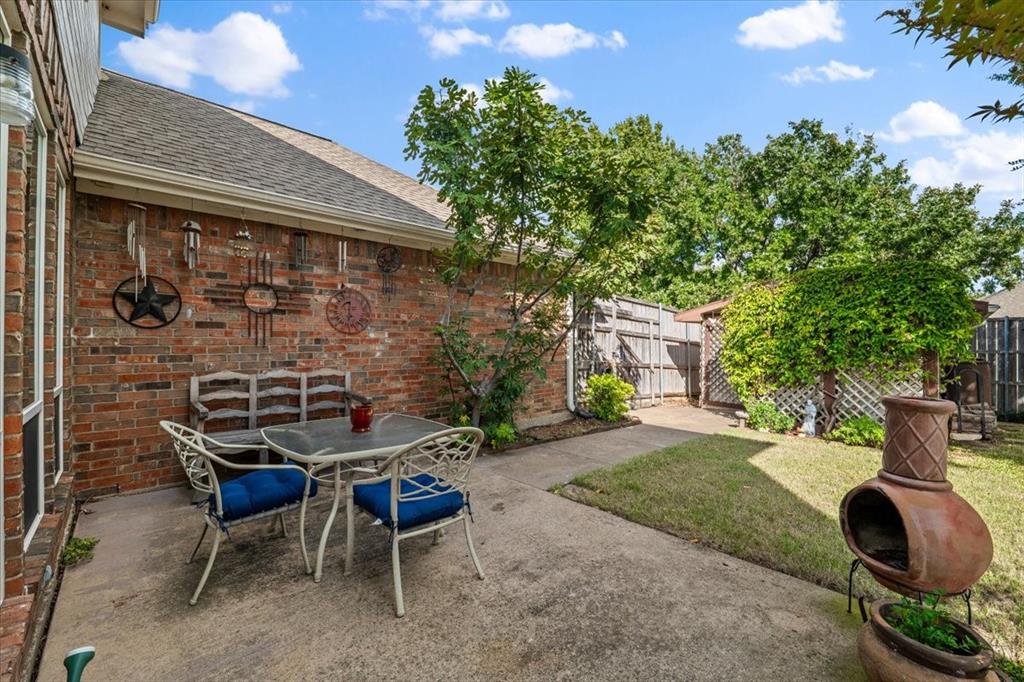 Privacy in east facing back yard - wood fence  - all yard art will go with the sellers