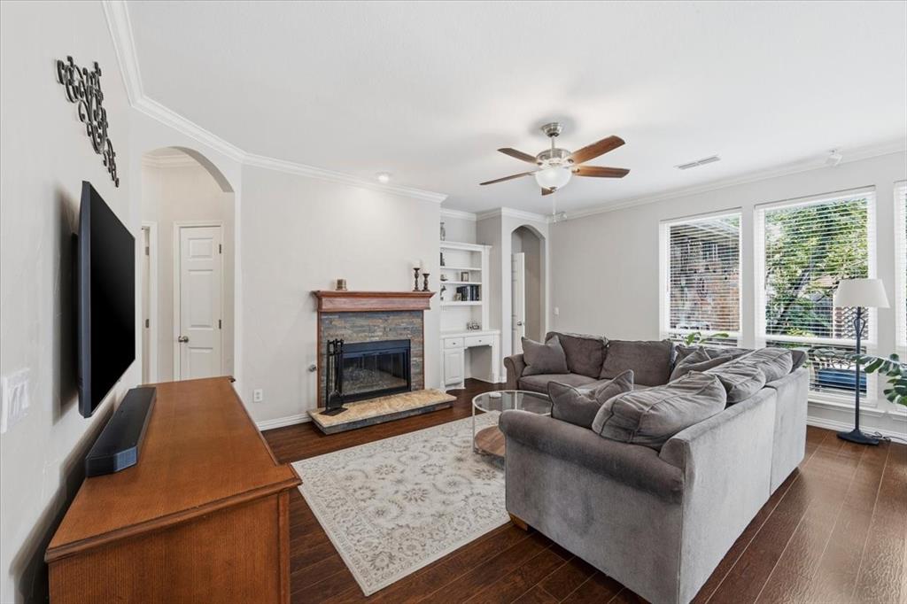 Custom fireplace with desk and bookshelf, open to kitchen and view to back yard - lots of storage in this home Custom fireplace with desk and bookshelf, open to kitchen and view to back yard - lots of storage in this home