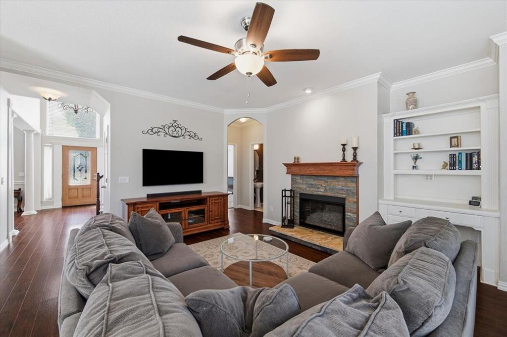 Open plan = small arch is to the half bath and primary suite - crown moldings